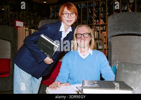 Caucasian Middle Aged Author and Middle Aged Woman at Book Presentation Stock Photo