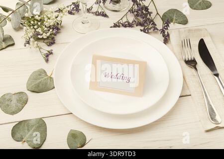 Collage Showing Wedding Table Setting With Flowers and Place Card on White Plate Stock Photo