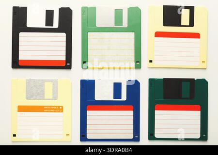 Collection of Colorful Floppy Disks Arranged in a Collage Format on a Simple Background Stock Photo