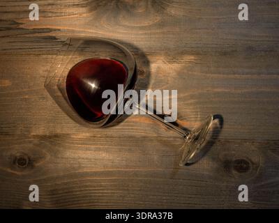 Red wine. Glass of wine on wooden background Stock Photo
