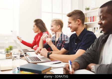 Group of Students Working Together in a Study Session at a Cozy Location Stock Photo