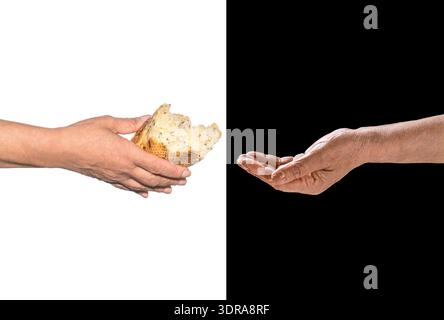 Poverty and world hunger concept. Hands grabbing for bread. Old man giving poor homeless person pieces of bread. A hand on a white background gives Stock Photo