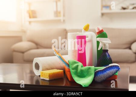 Collection of Cleaning Supplies Arranged on a Table in Bright Indoor Setting Stock Photo