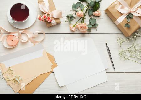Collection of Gifts and Stationery Set on a Wooden Table for a Special Occasion Stock Photo