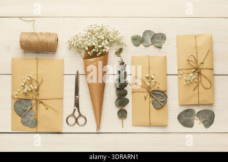 Gift Wrapping Setup With Natural Elements on a Wooden Table Stock Photo