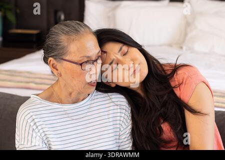 Spending quality time,  asian grandmother and granddaughter relaxing together indoors Stock Photo