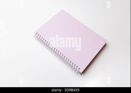 Pink Spiral Notebook. Vivid Pink Spiralbound Notebook With Textured Cover And Studio Lighting Stock Photo