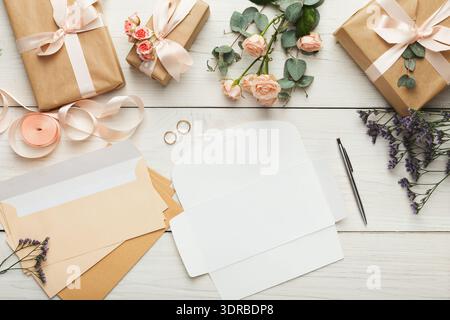 Collection of Gift-Wrapping Materials and Floral Decorations on a Wooden Table Stock Photo