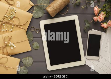 Set of Envelopes, Tools, and Devices Arranged on a Table for Planning and Organizing Tasks Stock Photo