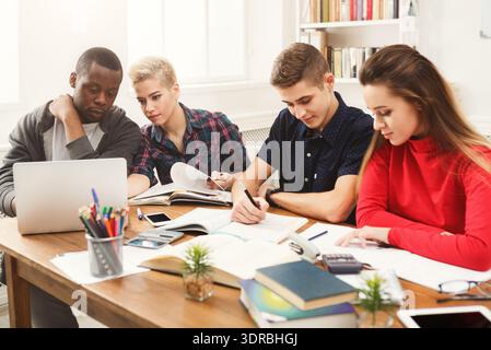 Group of Students Studies Together in a Bright Classroom During the Afternoon Stock Photo