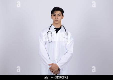 Professional doctor in white medical coat posing in studio Stock Photo