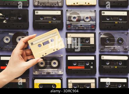 Collage of Vintage Cassette Tapes Arranged in a Mosaic Format on a Display Board Stock Photo