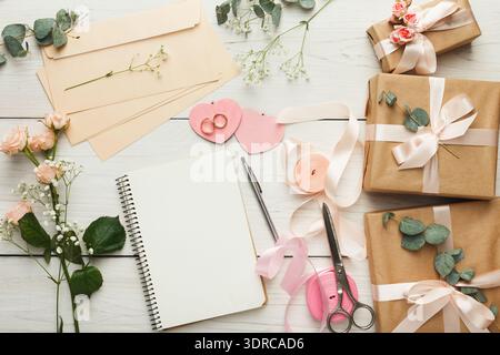 Collection of Wrapping Supplies and Craft Items on a Wooden Table Stock Photo