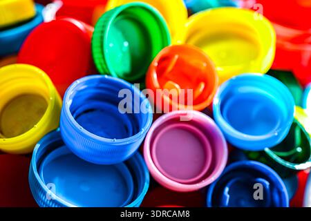Different sorts of colorful plastic bottle caps. Recycling. Stock Photo