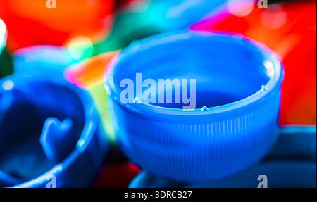 Different sorts of colorful plastic bottle caps. Recycling. Stock Photo