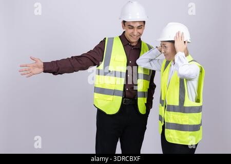 Senior and young engineers working together on building site Stock Photo