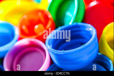 Different sorts of colorful plastic bottle caps. Recycling. Stock Photo