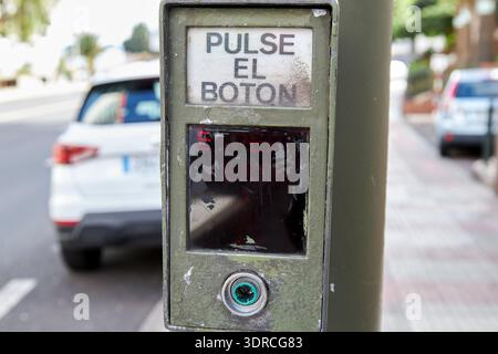 push the button and wait for green pedestrian crossing push button request in spanish santa cruz de tenerife canary islands spain Stock Photo