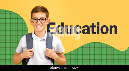 Cheerful Schoolboy With Glasses Stands Confidently on Yellow Background Ready for School Stock Photo