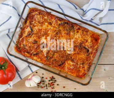 Baked aubergine slices with tomato sauce, cheese (Parmesan, mozzarella), garlic, Basil and spices. Eggplant Parmigiana. traditio Stock Photo