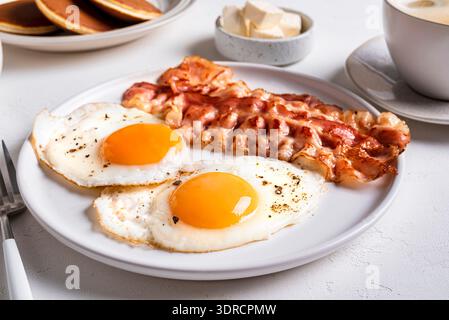 Breakfast with fried eggs and bacon Stock Photo