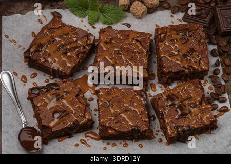 Brownie with chocolate sauce and caramel on the baking sheet Stock Photo