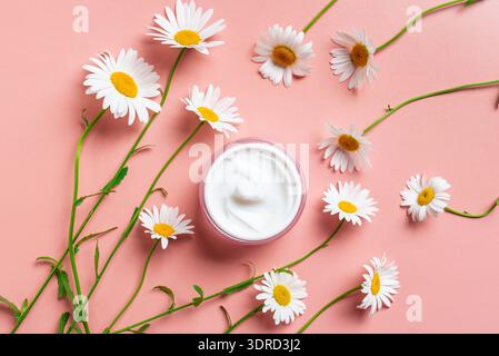 Natural organic face cream with chamomile flowers Stock Photo