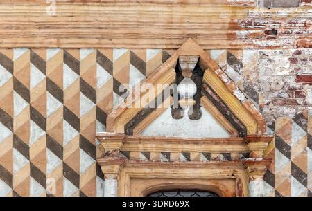 Weathered historic facade with an ornate window set into a geometric patterned wall of the Church of Our Lady of Hodegetria is an inactive Orthodox ch Stock Photo