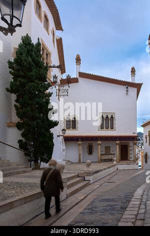 Sitges. Spain - February 18, 2026: Historic Museu del Cau Ferrat facade with traditional stone columns and whitewashed walls in old town street with p Stock Photo