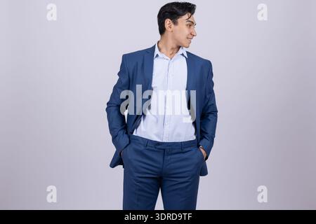 Businessman in a blue suit standing confidently Stock Photo