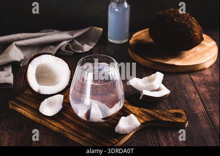 Tropical cocktail hard seltzer with coconut in a glass on the table Stock Photo