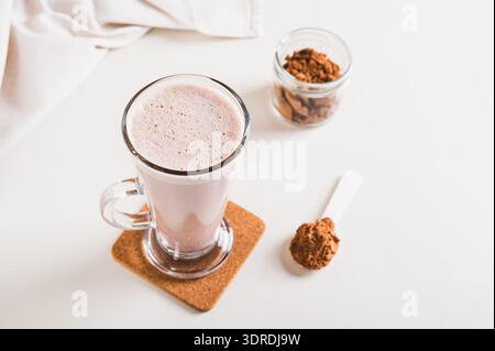 Chocolate protein energy shake drink in a glass on the table Stock Photo
