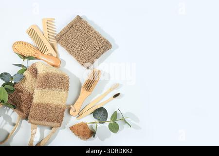 Set of eco friendly body care items, bamboo toothbrushes, wooden massage brushes and combs, natural washcloths, spa and wellness Stock Photo