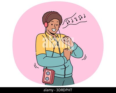 African American man in retro clothes with cassette player on belt listens to music in headphones Stock Photo