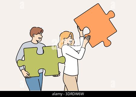 Couple of man and woman are working on building relationships, holding puzzle pieces in hands Stock Photo