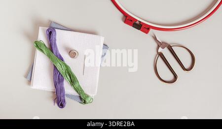 Embroidery kit on gray background top view web banner Stock Photo