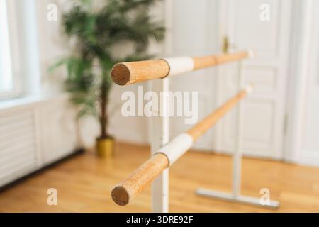 Empty ballet dance studio with barre. Professional ballet barre for stretching practicing dancing positions in dance school Danc Stock Photo