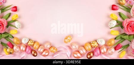 Festive easter banner,spring composition with decorated homemade eggs and blooming flowers,creative concept of easter,ideas for Stock Photo