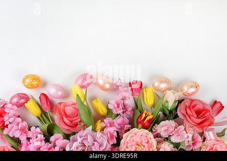 Festive easter banner,spring composition with decorated homemade eggs and blooming flowers,creative concept of easter,ideas for Stock Photo