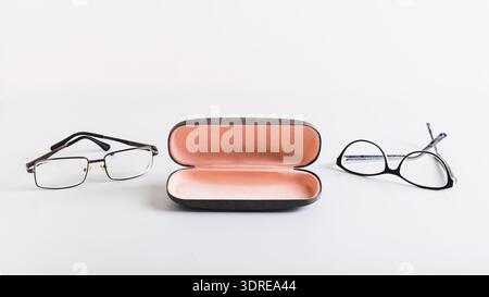 Open hard storage case and eyeglasses nearby on the table web banner Stock Photo