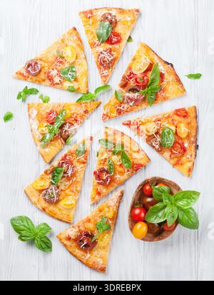 Pizza with tomatoes, mozzarella and basil Stock Photo