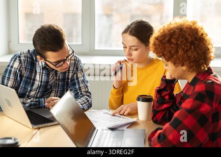 Focused female team leader discuss financial statistics brainstorming business meeting with partners clients at office. Lady bos Stock Photo