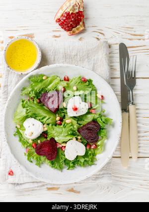 Fresh salad with goat cheese, roasted beets and lettuce. Stock Photo