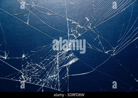 Fractured Smartphone Surface: Sharp Glass Shards and Web-Like Damage texture Stock Photo