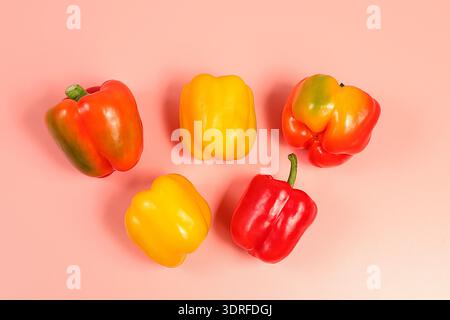 Sweet bell pepper on light background. Various ripe red and yellow fruits for healthy vegetarian food and detox diet, harvest. A Stock Photo