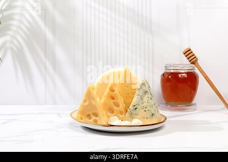 Assortment of different types of cheese, Blue cheese, Roquefort, Parmesan, Mozzarella, Maasdam with honey, Healthy and natural f Stock Photo