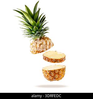 Fresh juicy tropical fruit pineapple flying isolated on white background. Sliced ananas pineapple falling. Stock Photo