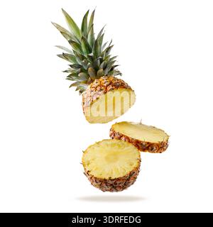 Fresh juicy tropical fruit pineapple flying isolated on white background. Sliced ananas pineapple falling. Stock Photo