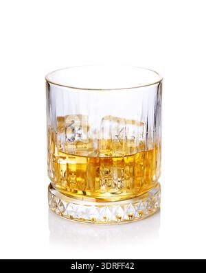 A classic whiskey glass filled with golden amber whiskey Stock Photo