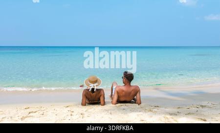 Couple Spending Quality Time Together While Relaxing on the Beautiful Beach of Koh Kood in Thailand Stock Photo